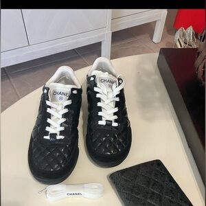 CHANEL Black Quilted Sneakers with White Accents